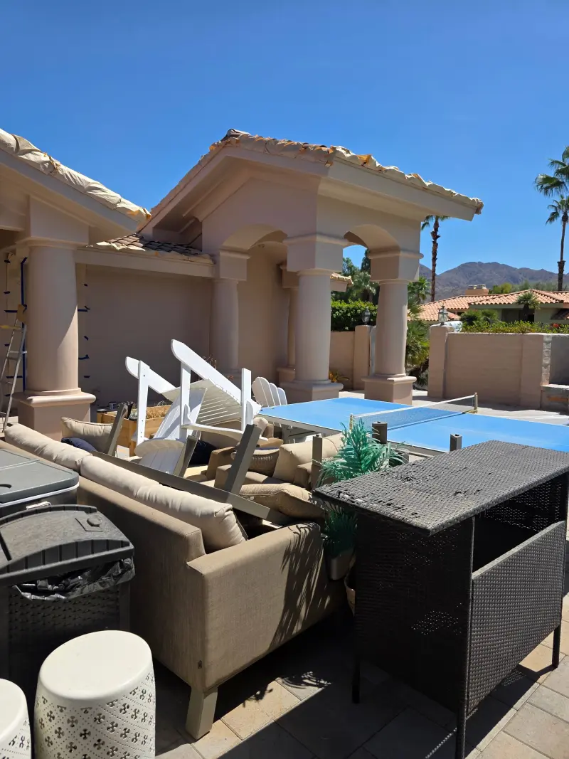 Indian Wells courtyard furniture covered during elastomeric paint surface preparation