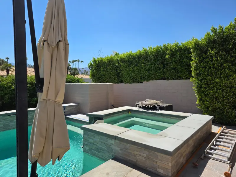 Stucco coating Indian Wells completed around backyard spa and pool with refreshed walls