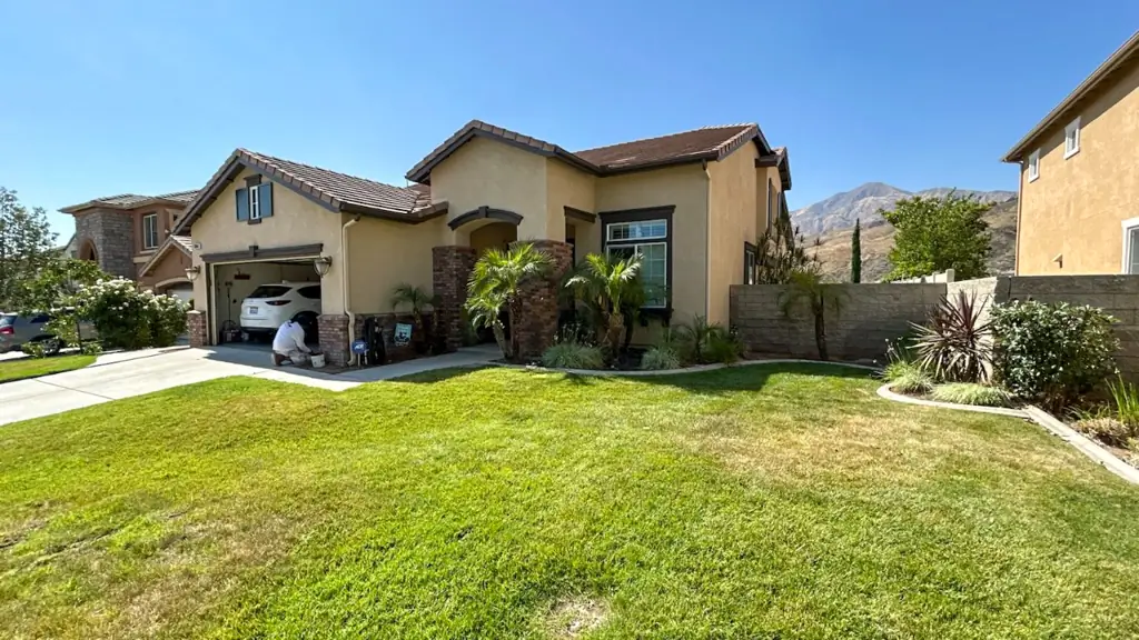 Weathered stucco walls on Highland CA home before professional stucco painting restoration