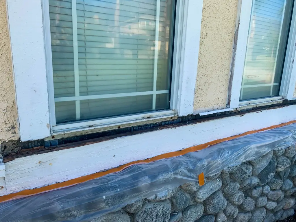 Rotting window sill in Rancho Cucamonga home before wood frame repair and exterior painting