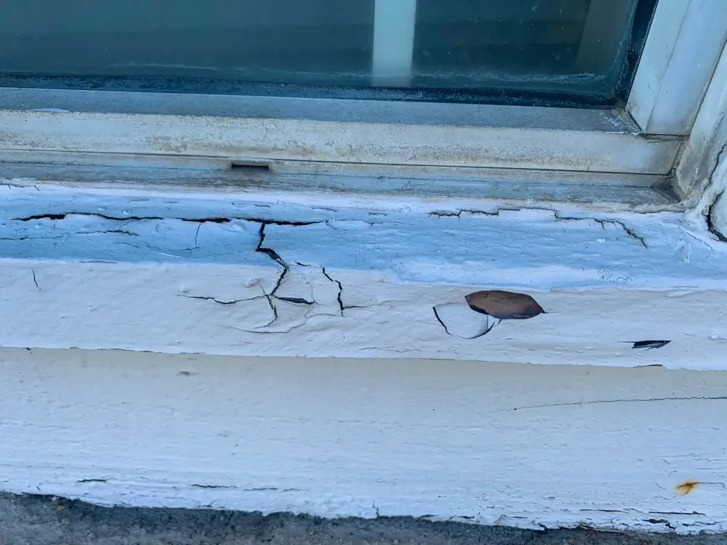 Window frame repair Rancho Cucamonga — trim removed revealing wood decay below window