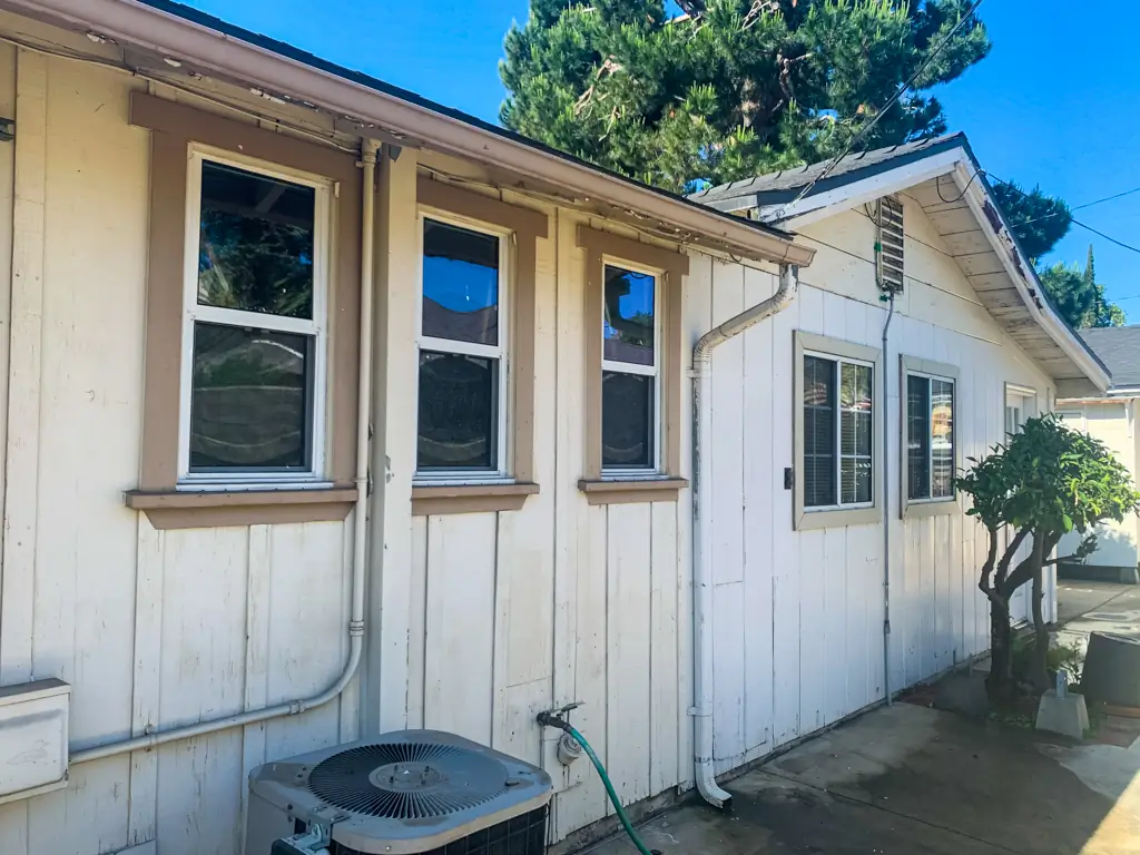 San Gabriel home before exterior painting showing weathered wood siding and faded trim