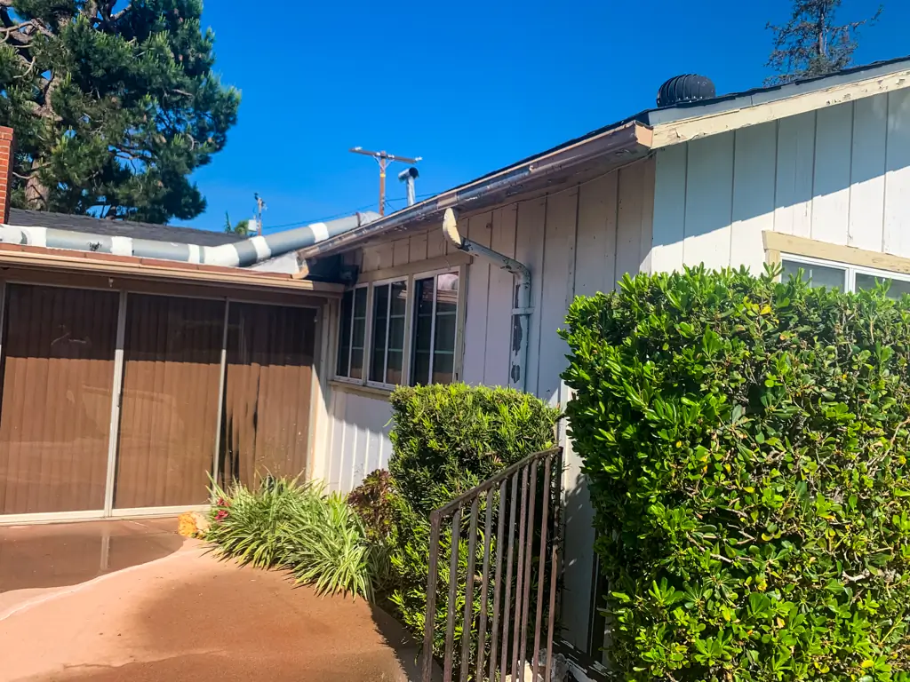 House painting San Gabriel before showing peeling siding and worn patio exterior