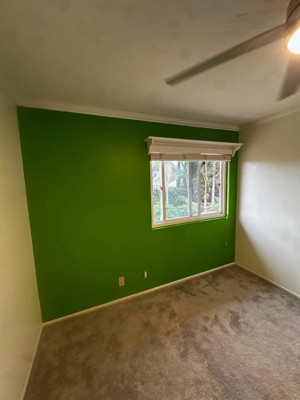 Accent wall painting Whittier — vivid green bedroom wall with crisp edges