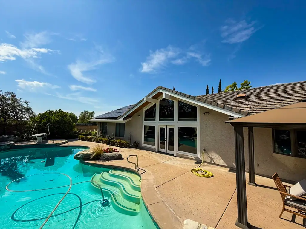 Exterior painting Yorba Linda completed showing polished stucco finish and pool area view