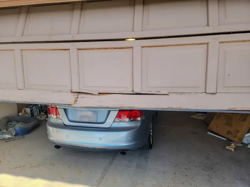 Worn garage door surface showing faded finish before garage door makeover in Los Angeles